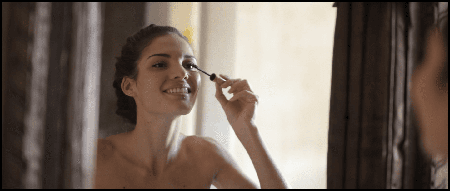 girl applying mascara